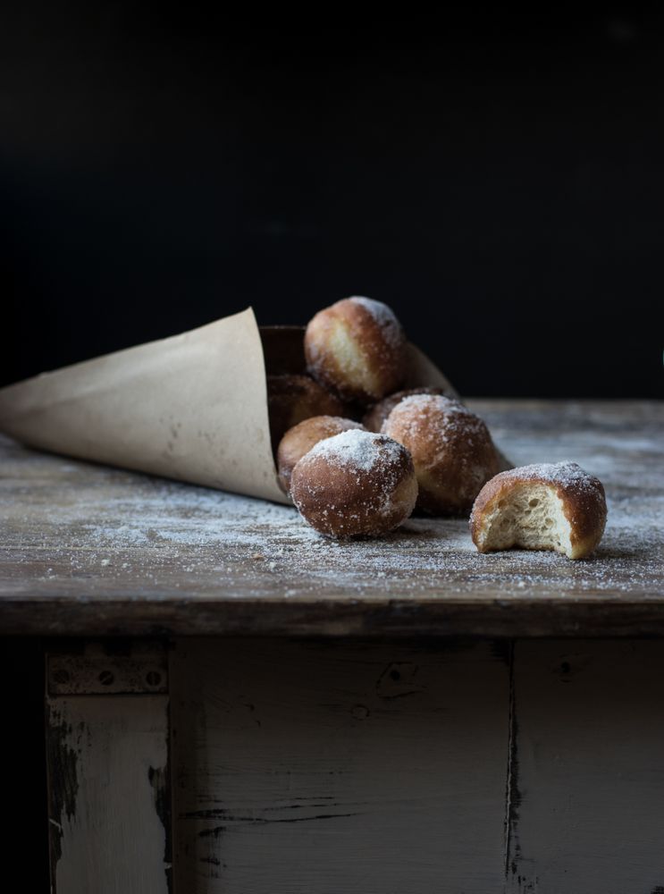Baked cakes in craft paper on table