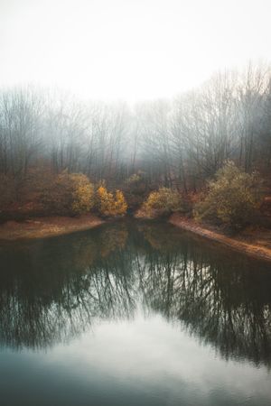 Tranquil water of lake in mist