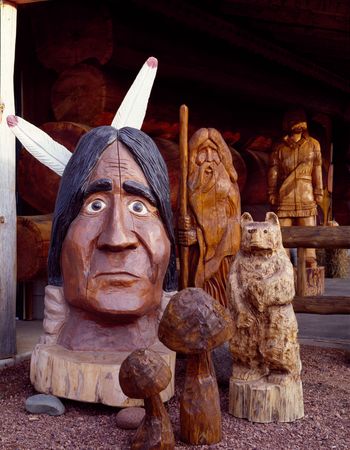 Wood carvings of a Native American, mushrooms, bear and wizard, Eagle River, Wisconsin