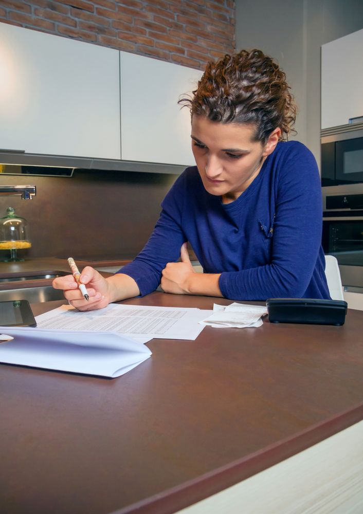 Woman reviewing her monthly bills