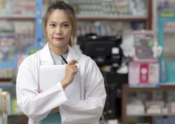 Asian female pharmacist, drug consultant.