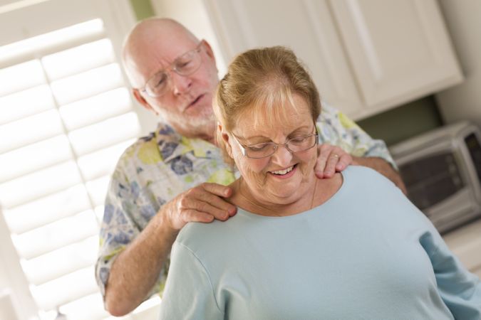 Adult Husband Giving Wife a Shoulder Rub
