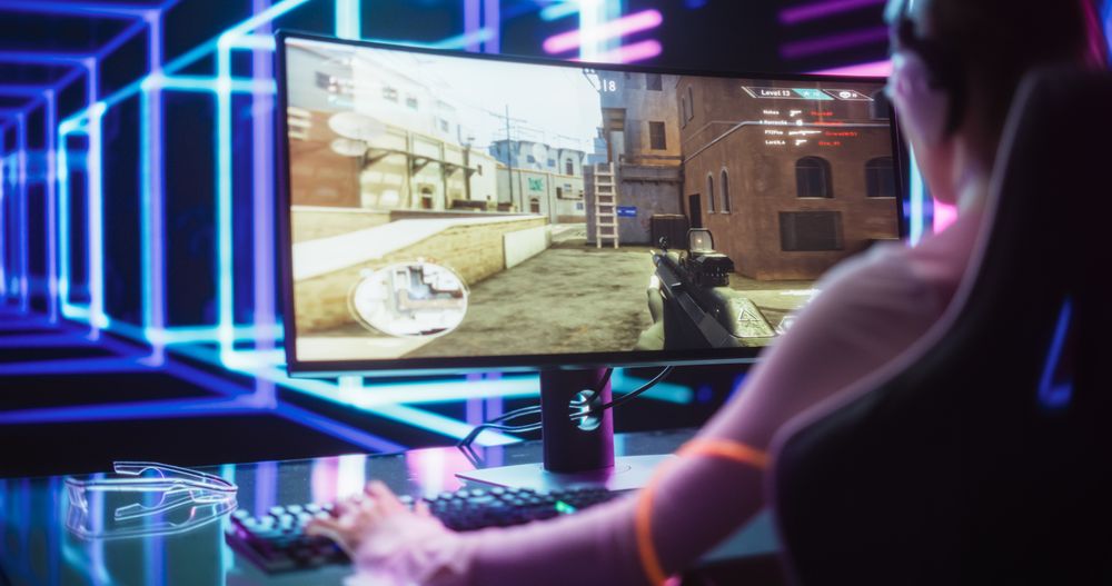 Young Female Professional Gamer Competing in an E-Sports Championship Event in a Futuristic Neon Arena.