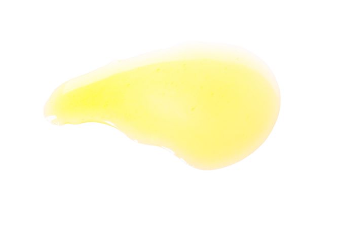 Sweet honey smear isolated on neutral background
