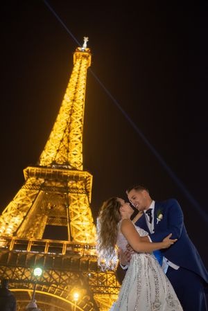Overjoyed bridal pair enjoying in each other while kissing
