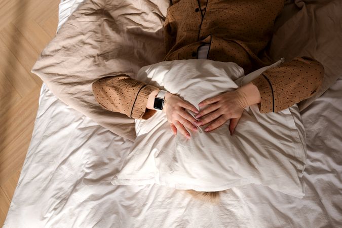 Person sleeping with smartwatch