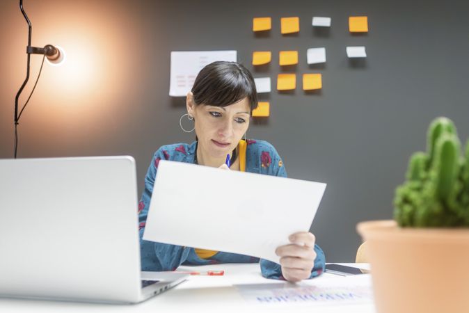 Smiling businesswoman working with documents