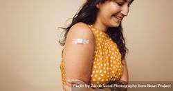 Female received vaccination on her arm 5Rj1B5