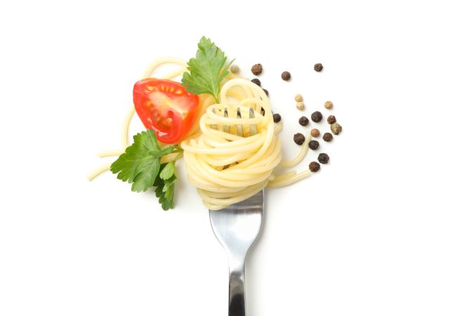 Fork with tasty pasta isolated on plain background