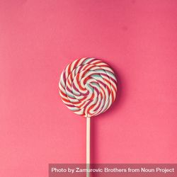 Swirling lollipop against pink background 0LPWr0