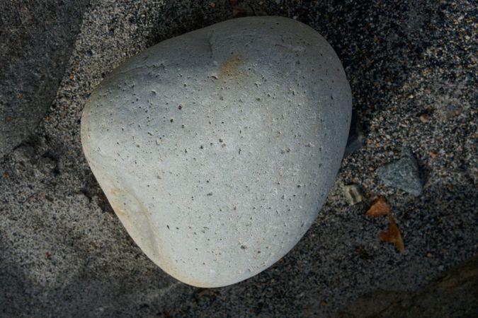 A grey stone wall corner with horizontal stone arrangements forming strong geometric perspective lines giving a sharp architectural feel