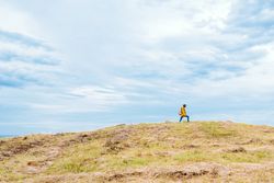 Female traveler on hill