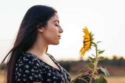 Portrait of a young woman with long hair in the countryside