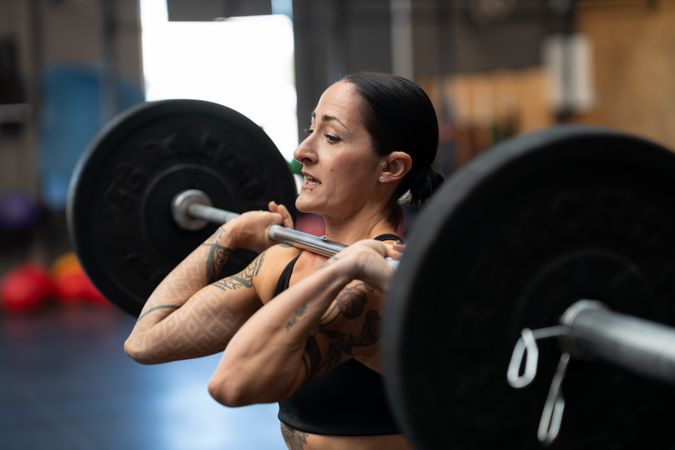 Bodybuilder working out in a cross training center