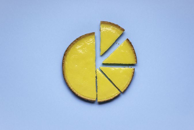Lemon pie cut in half and sliced