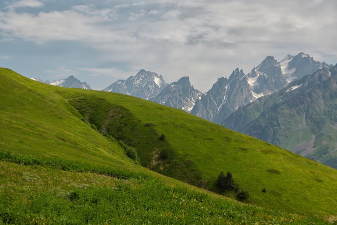 Green plateau near Caucasus mountains in Georgia
