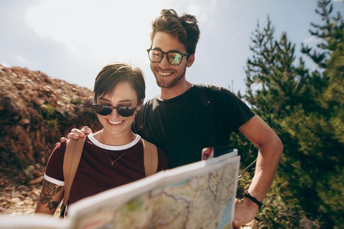 Couple using a map to locate their destination