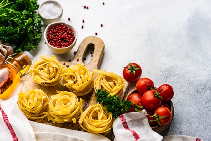 Ingredients for pasta dish on counter with copy space