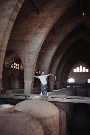 B boy dancing on overpass in abandoned building