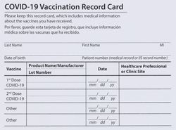 Covid 19 vaccination record card in full frame layout
