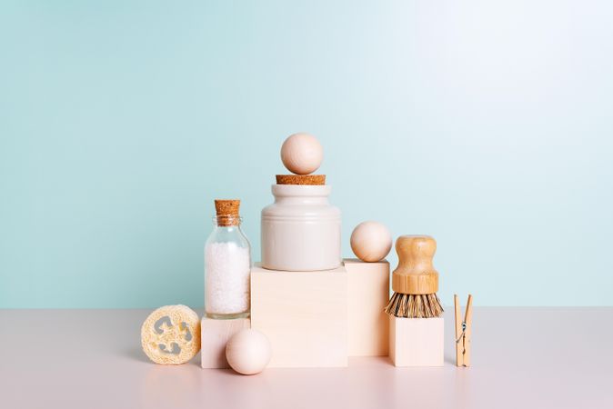Natural self care products stacked up with blue backdrop
