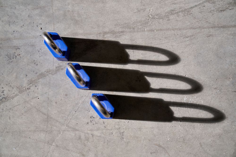Set of secure locks placed on concrete floor