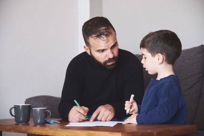 Father and son drawing together