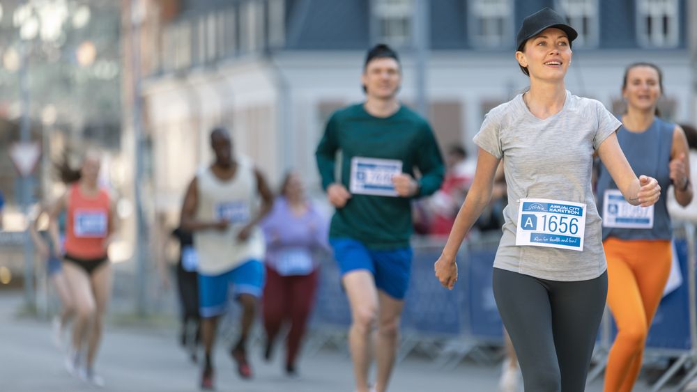 Smiling Group of People Participating in a City Marathon.