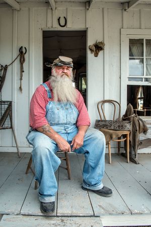 "Uncle Bob" Beringer is photographed on an authentic sharecropper's cabin, Fort Bend County, Texas