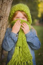 Portrait of Cute Young Girl Wearing Green Scarf and Hat