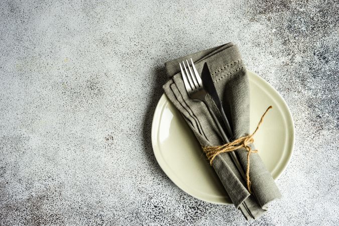 Top view of grey table setting on concrete background