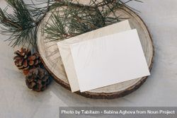 Blank greeting card, invitation mockup on cut wooden round board 0gE2A4