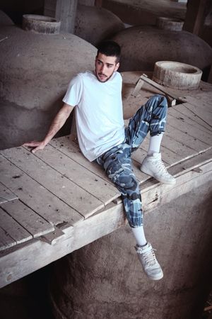 Cool modern man in neglected building
