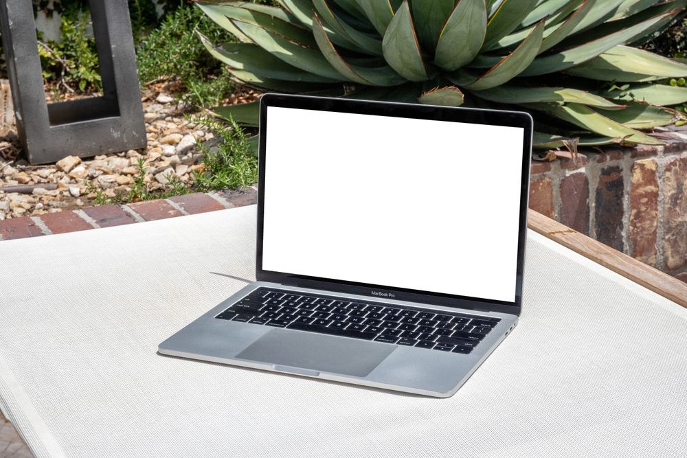 Laptop mockup on sunny day outside