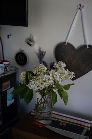 Blooming lilacs at home with some antique decorations