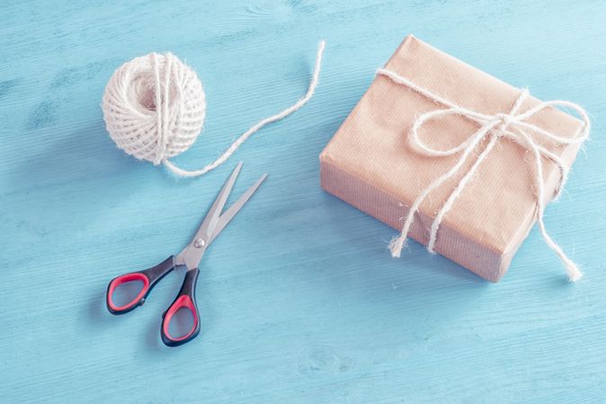 Present wrapped in brown paper tied with natural colored string