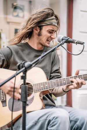 Male musician performing in the street