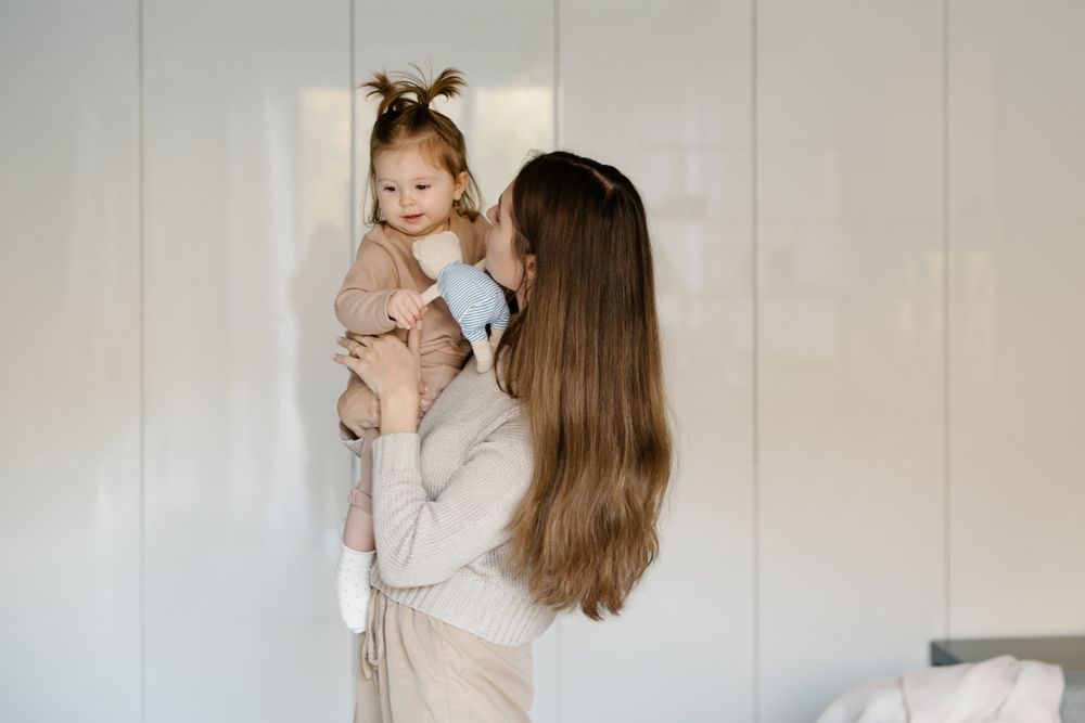 Mother holding toddler