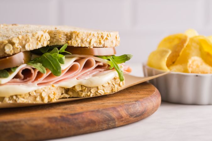 Delicious sandwich with ham, cheese, lettuce and tomato