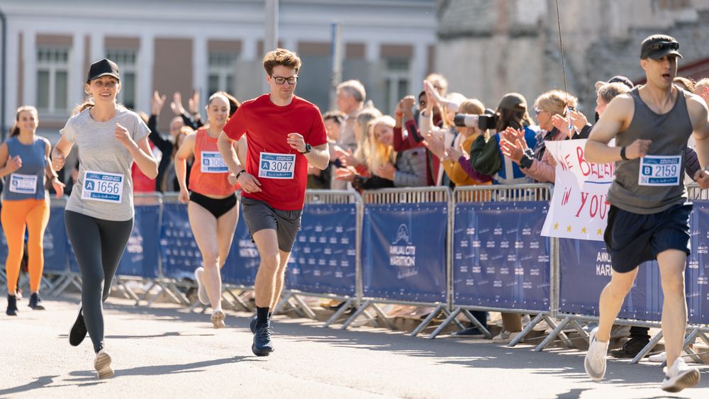 Smiling Group of People Participating in a City Marathon.