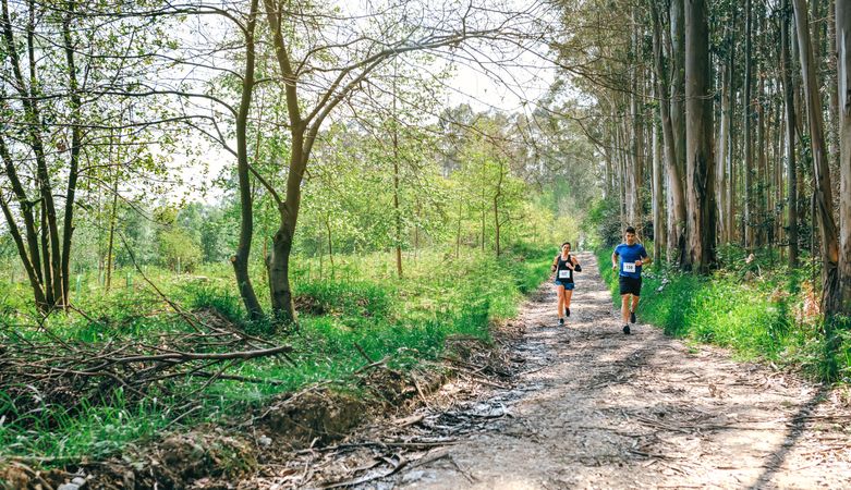 Young woman and man doing trail