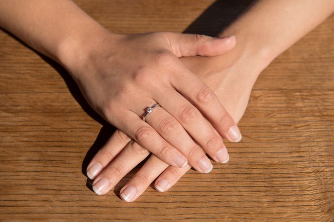 Crop female hands with engagement ring