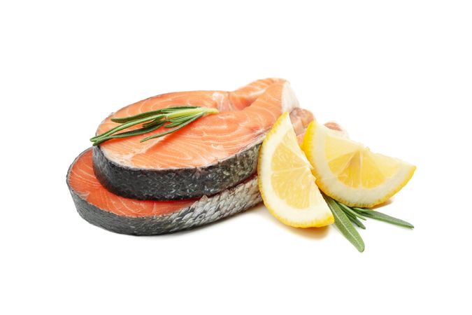 Fresh raw salmon meat and spices isolated on light background