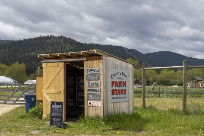 Farm stand in Montana with mountains in the background