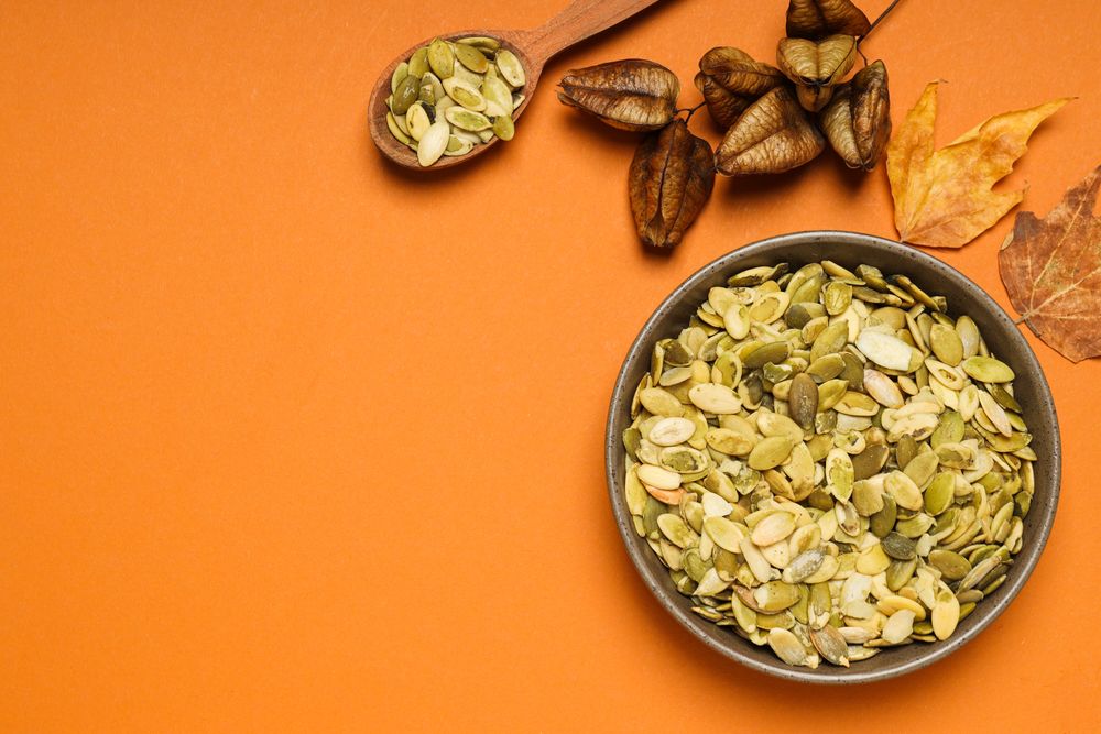 Cooking ingredients for fall season - pumpkin seeds, pumpkin