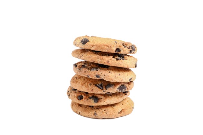 Stack of tasty chocolate chip cookies on white background