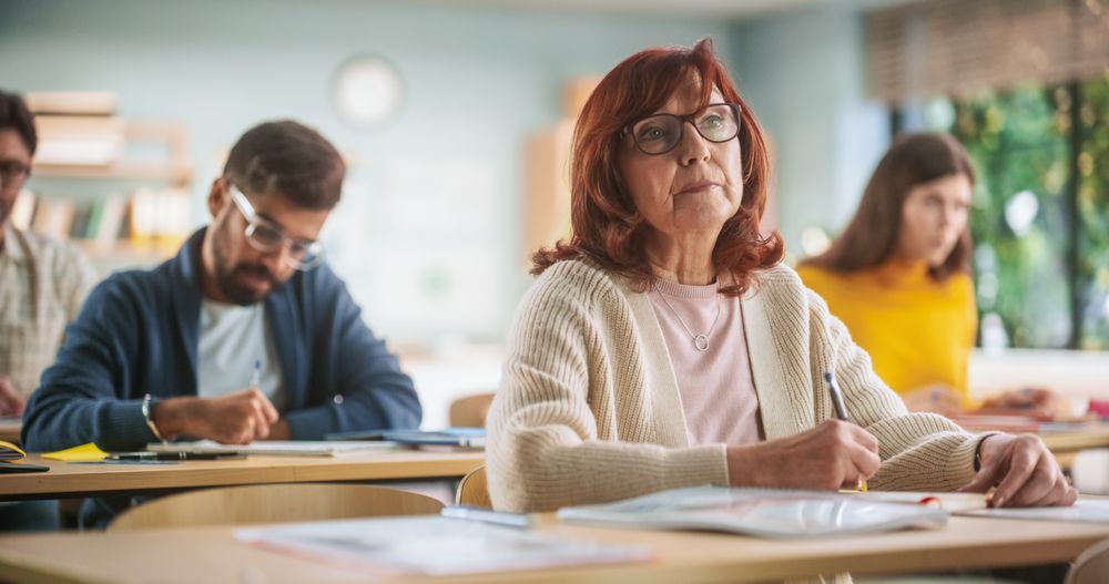 Portrait of Happy Mature Woman Taking a Course in an International Adult Education Center.