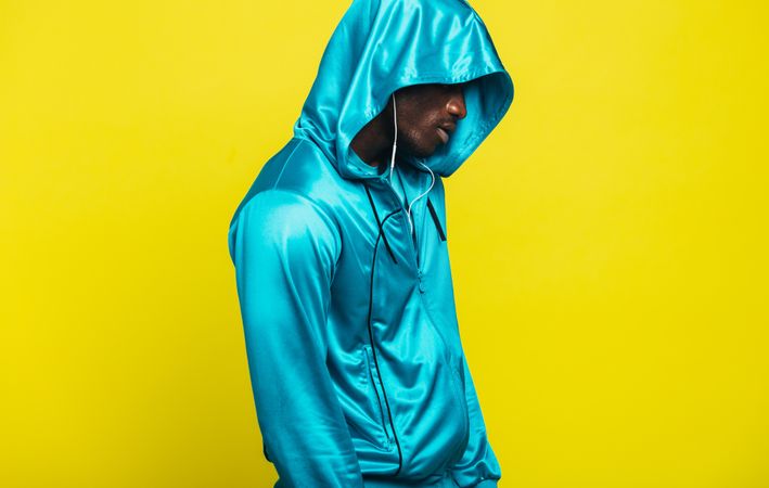 Black man in a shiny hoodie