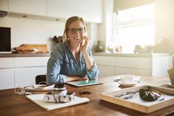 Photographer working from home in her kitchen