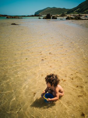 little girl building a sand castle